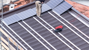 Installation of solar panels on a roof.