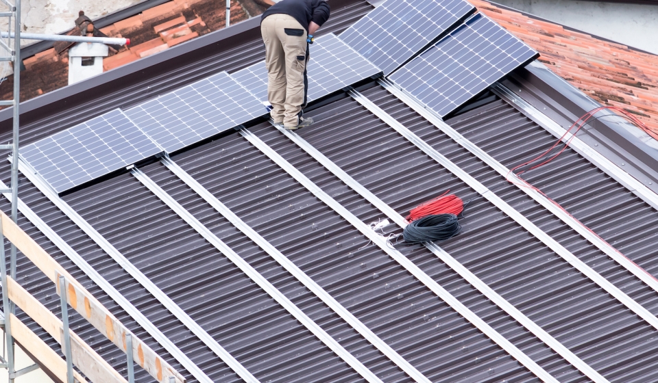 Installation of solar panels on a roof.